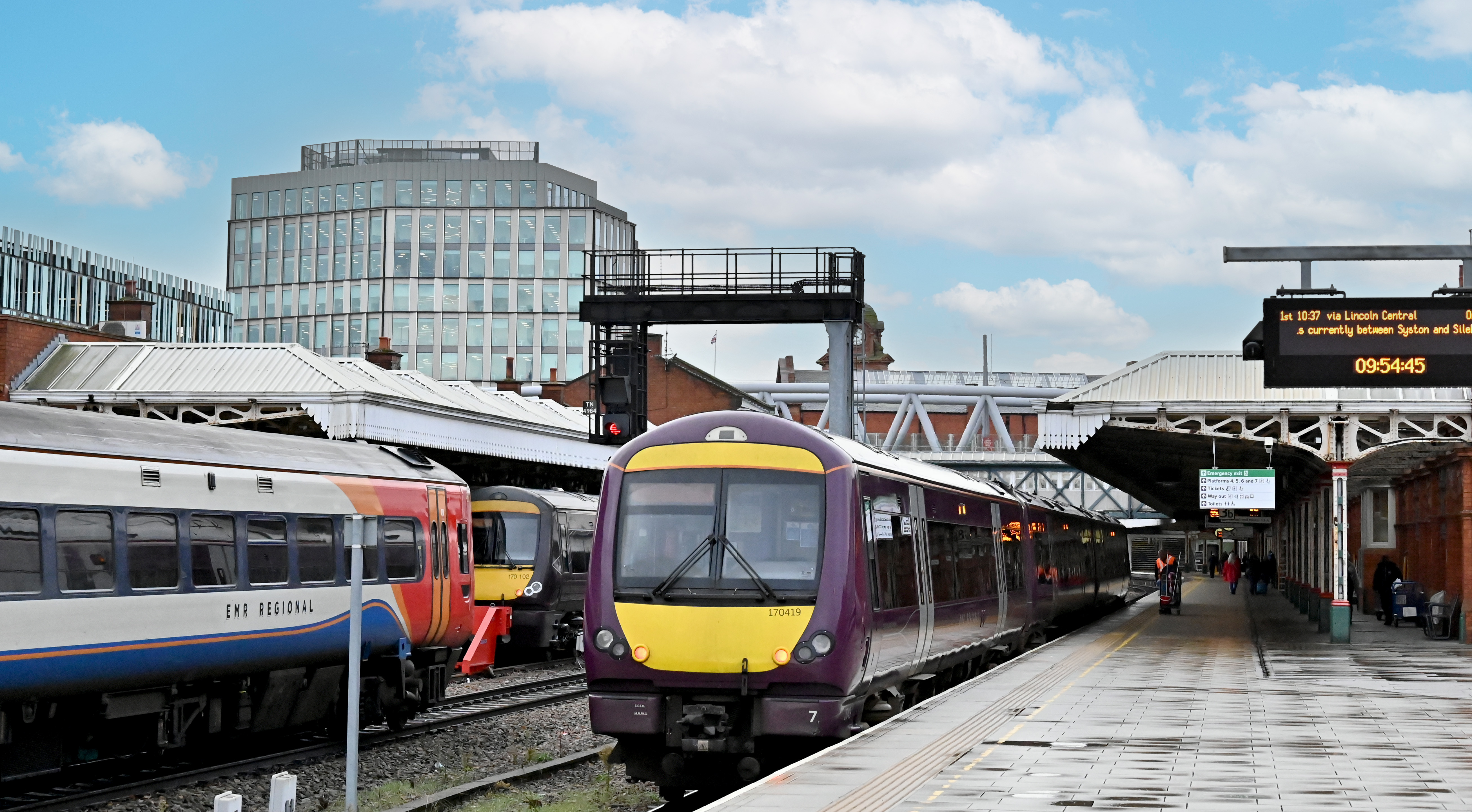 Photo of a platform at Nottingham station. Three trains are pulled up on the tracks. 