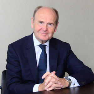 Portrait photo of Sir John Peace